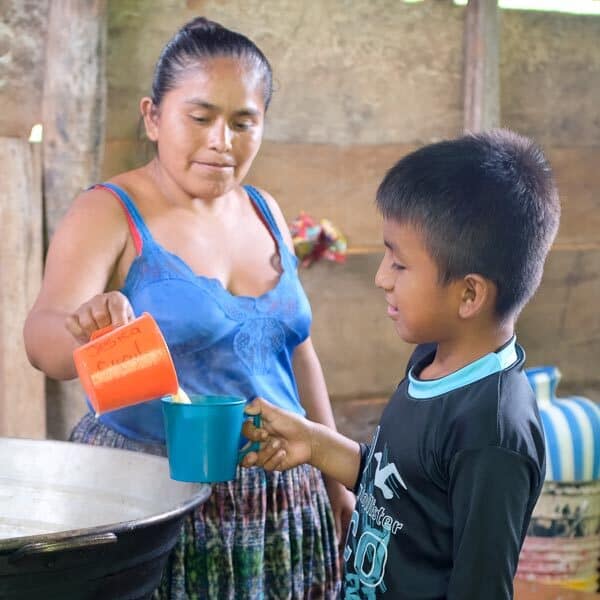 SchoolSnacks-1 Guatemalan student receiving nutrient-enriched school snack