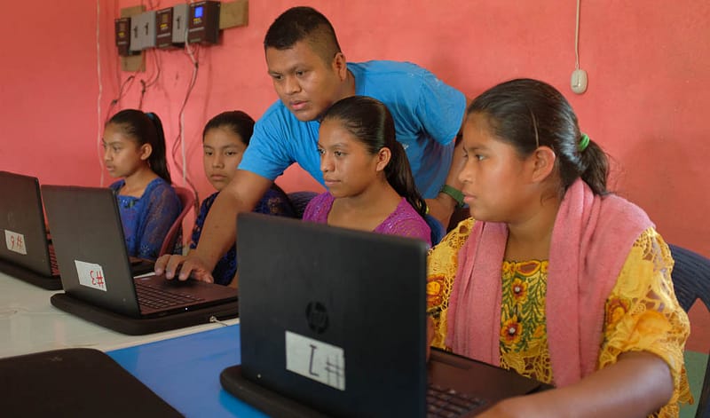 TeacherWithStudentInComputerLab
